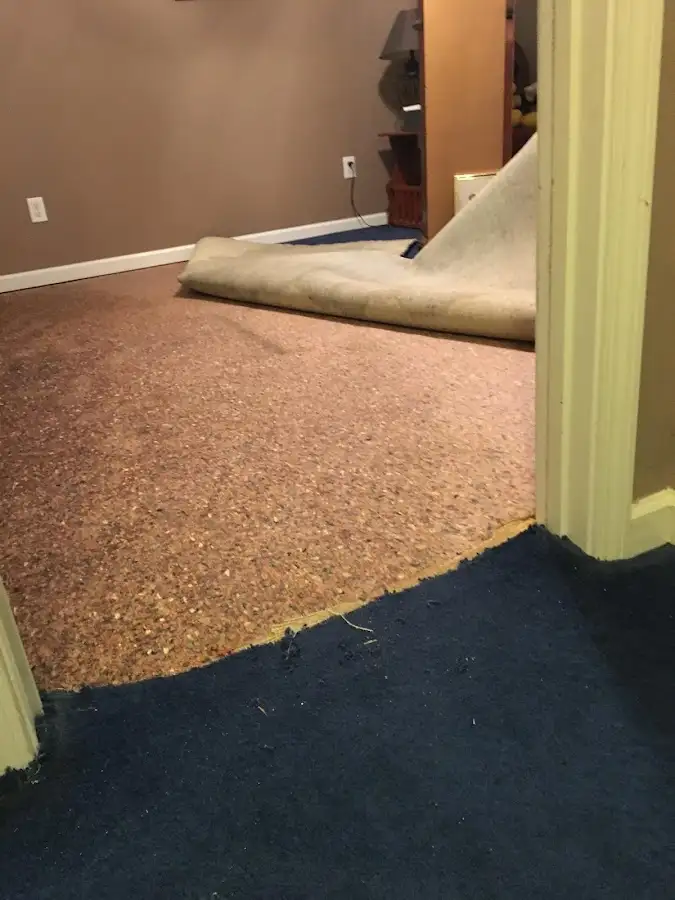 Carpet pad removal revealing water damage during Drying & Dehumidification in Firebaugh